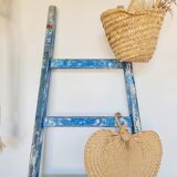 Old ladder in blue wood