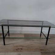 Vintage coffee table in glass and mirror strips.