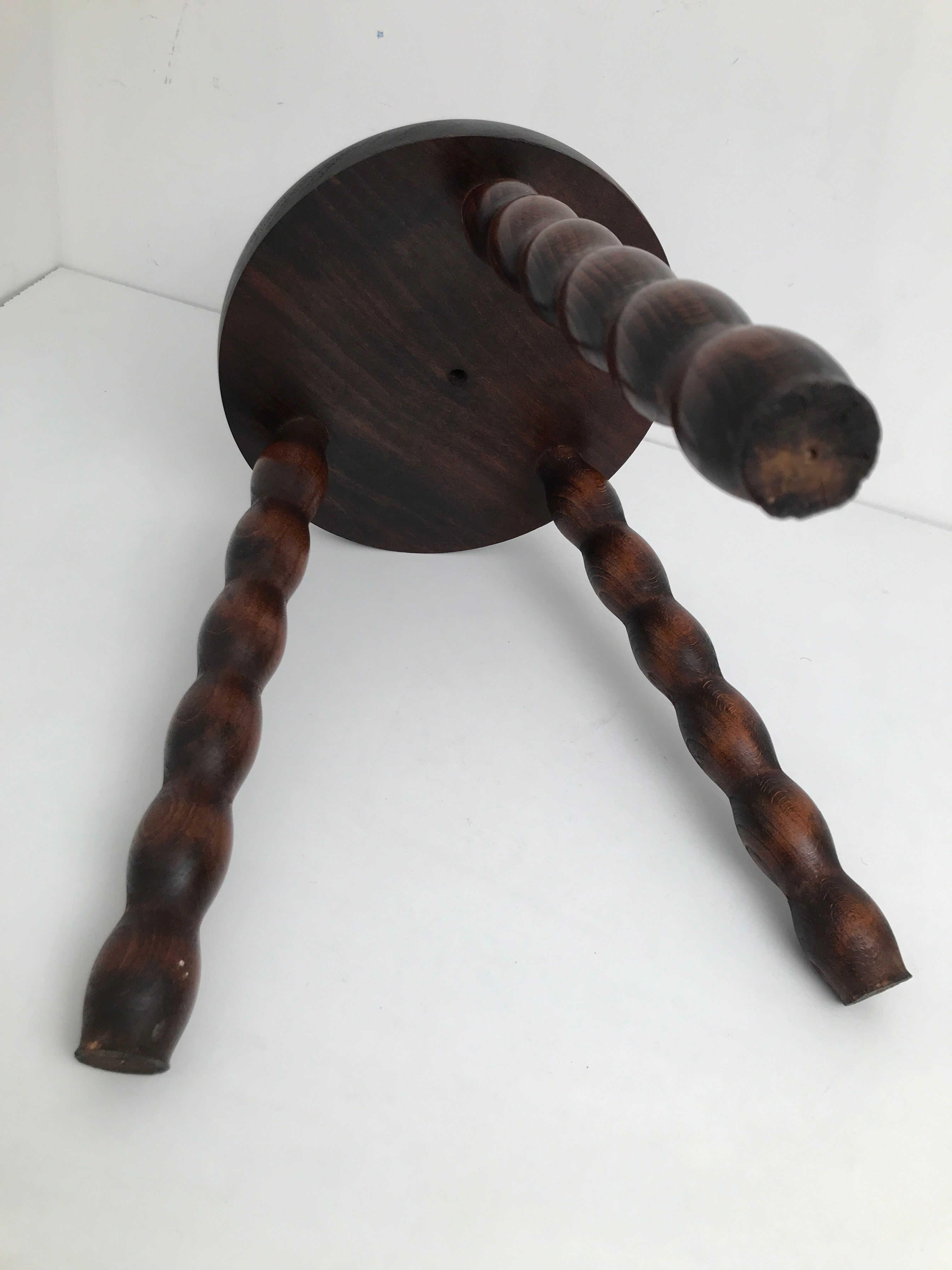 Wooden stool turned tripod foot