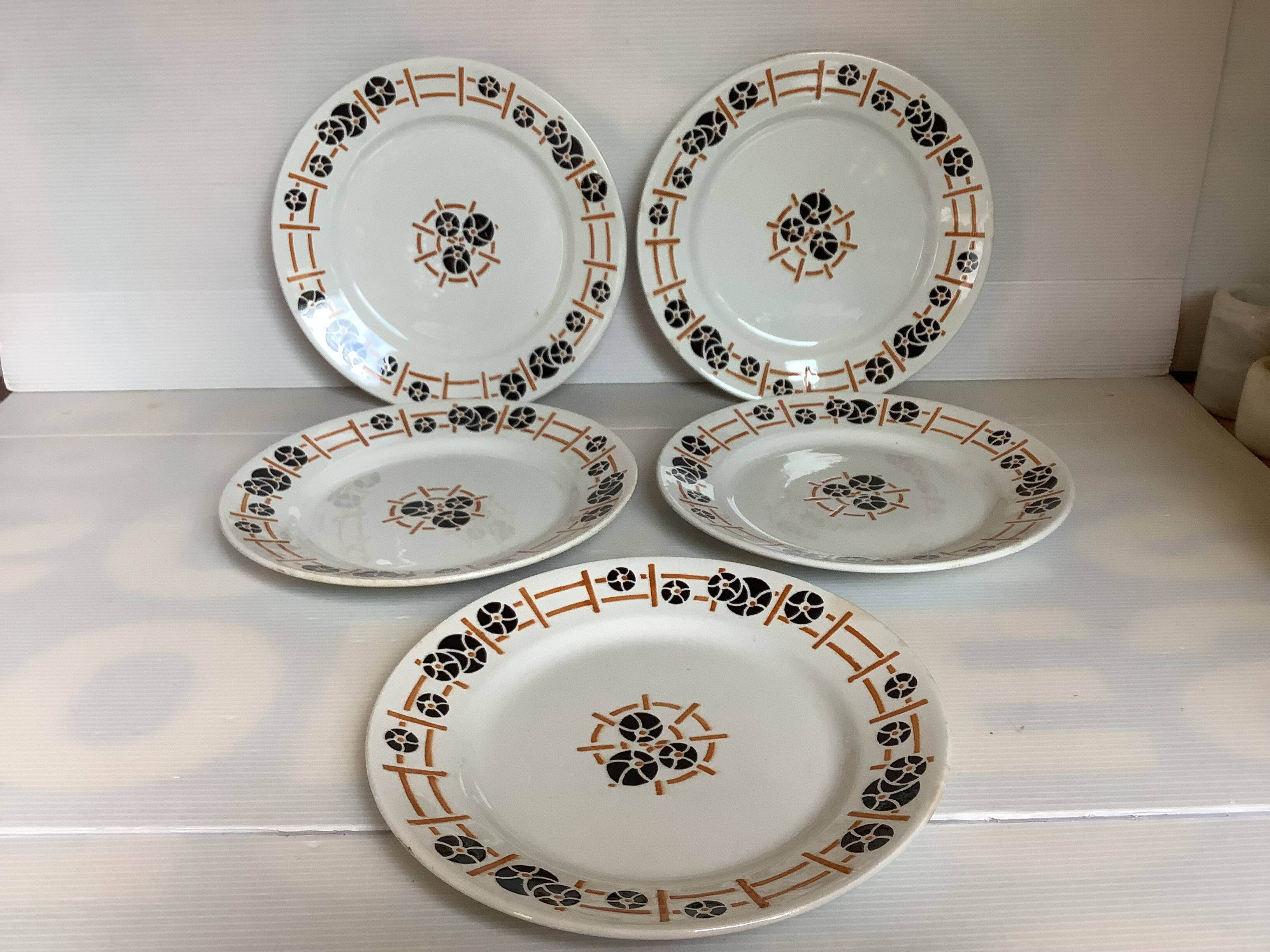Five old flat earthenware plates from the 1930s, water lilies model