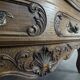 Commode néo rustique galbée richement sculptée