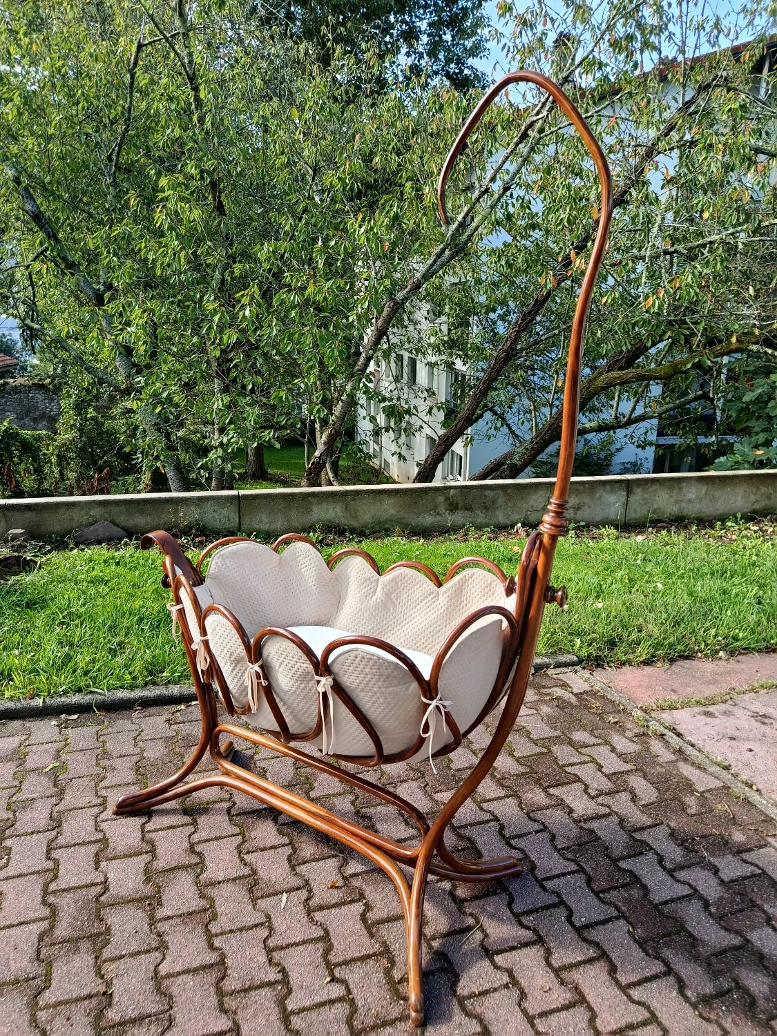 Antique cradle by J&J Khon