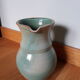 Pitcher with handle green celadon turquoise and caramel