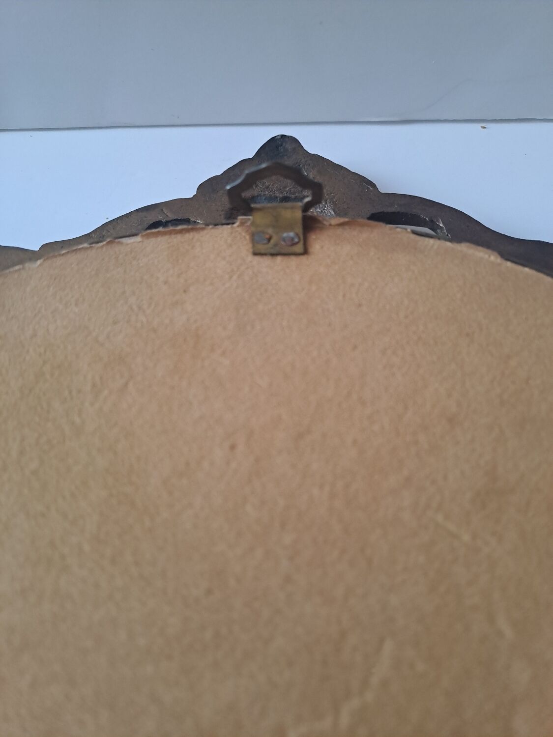 Painted under glass convex medallion in bronze