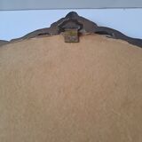 Painted under glass convex medallion in bronze