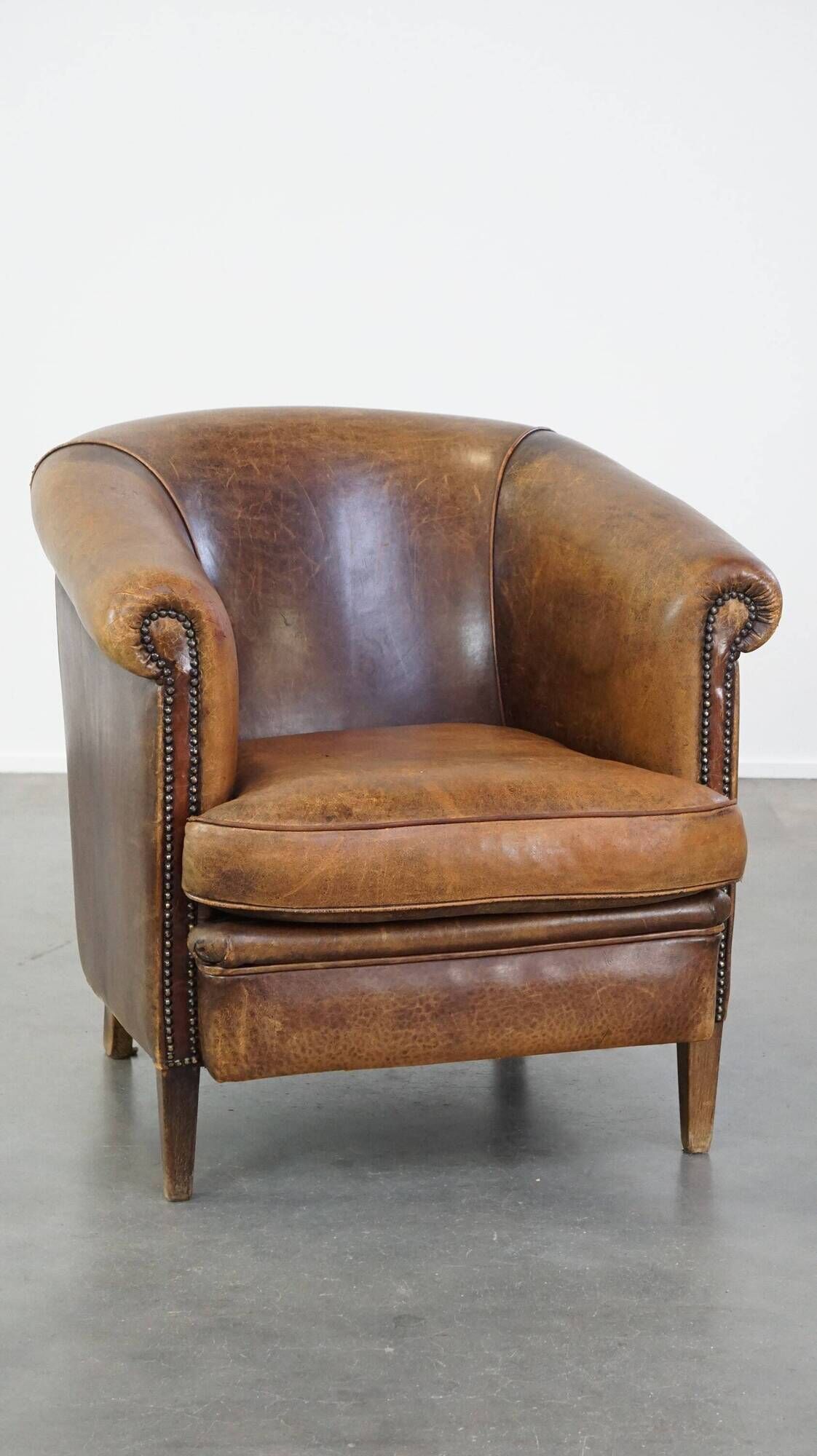 Characterful sheepskin leather club armchair with a luxurious, rustic appearance