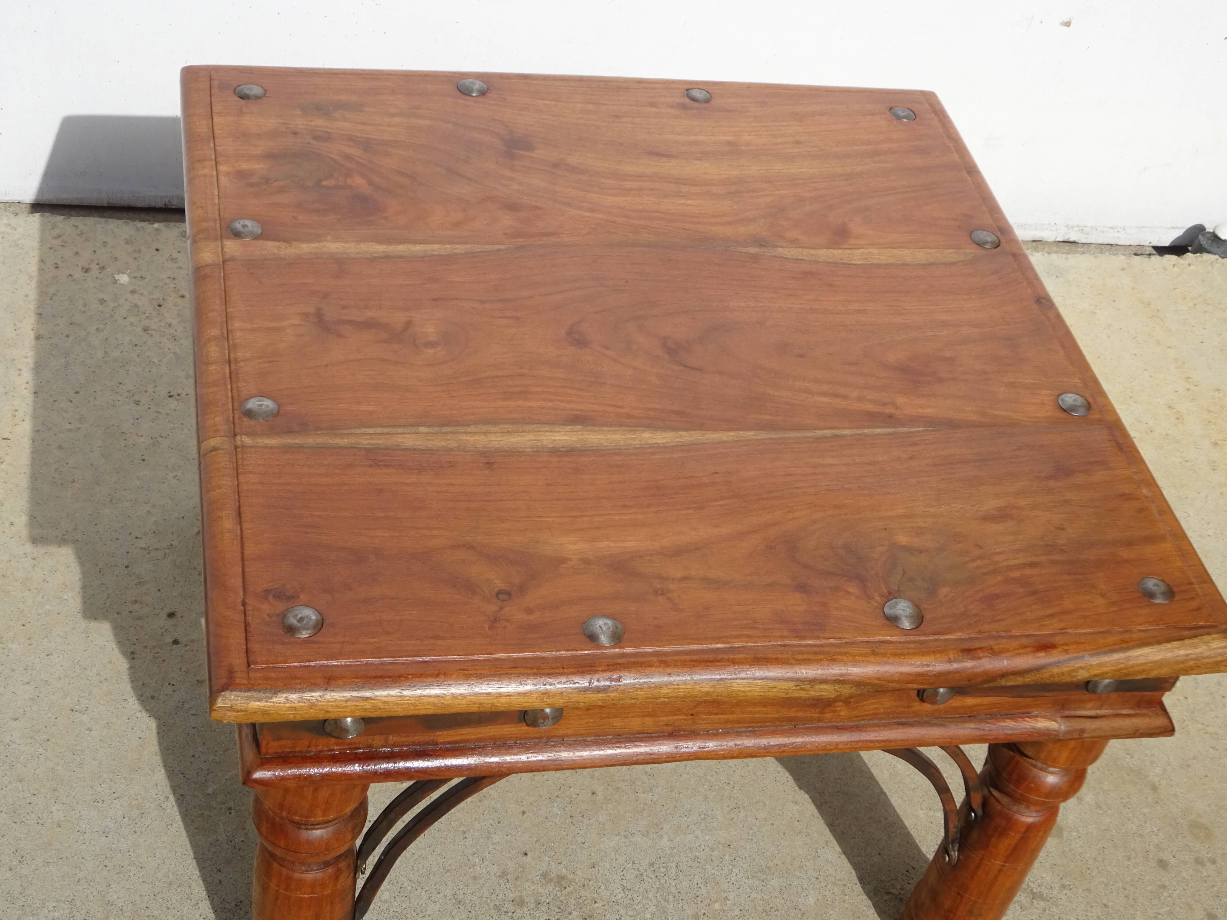 Square coffee table in exotic wood and wrought iron.