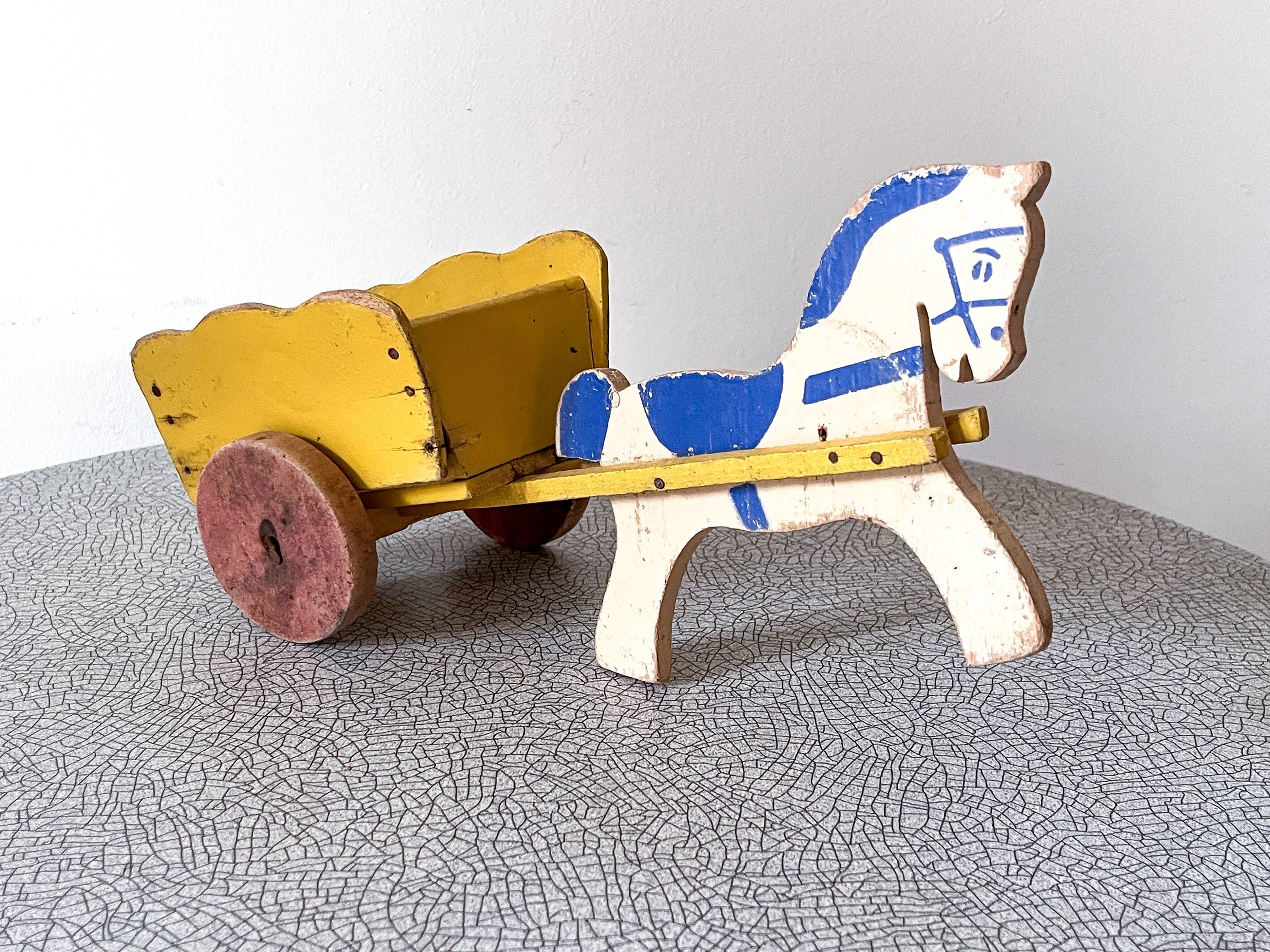 Horse cart and cart, old wooden pull toy.