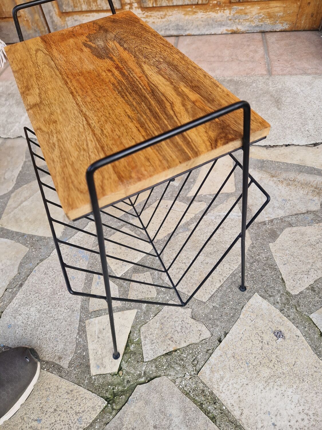 Bedside table with magazine holder