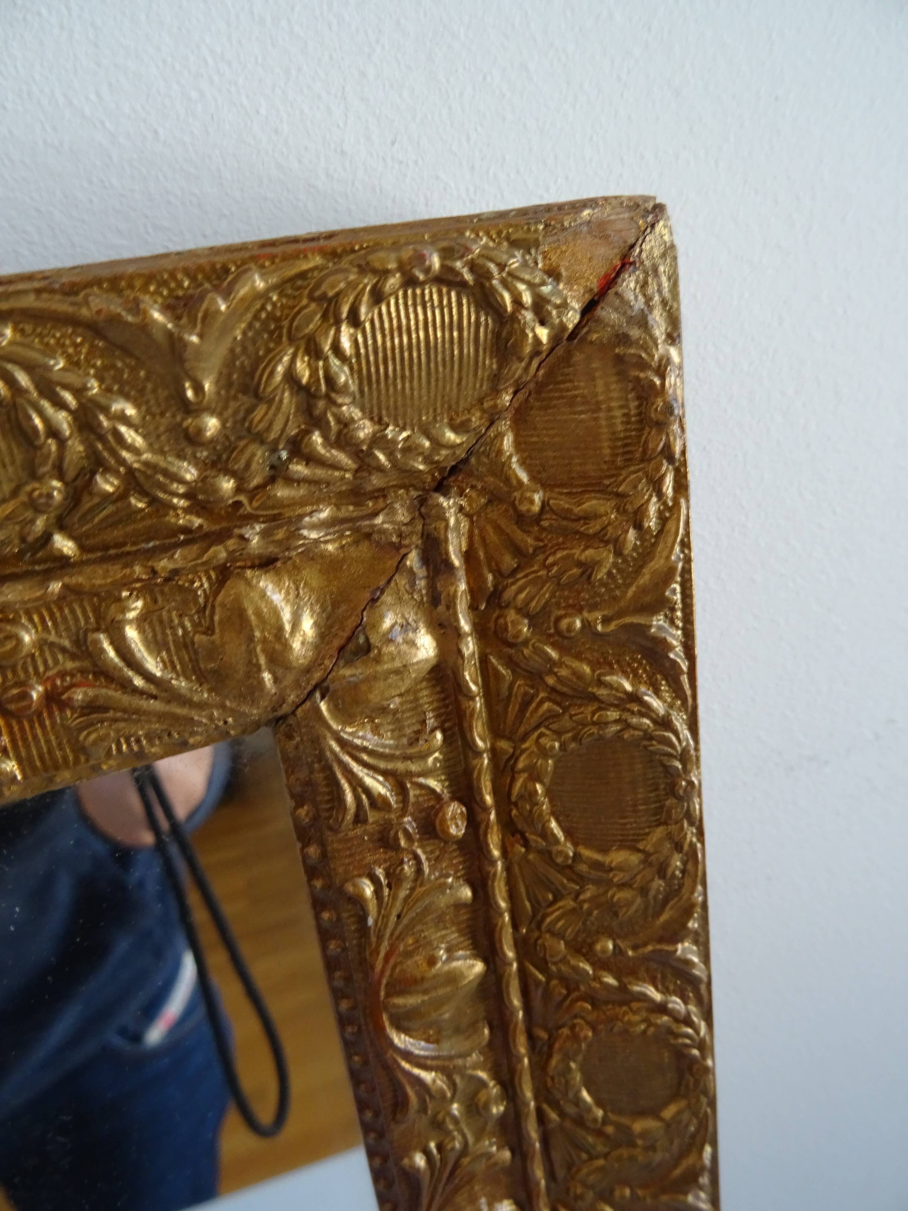 Wood and gilded stucco wall mirror