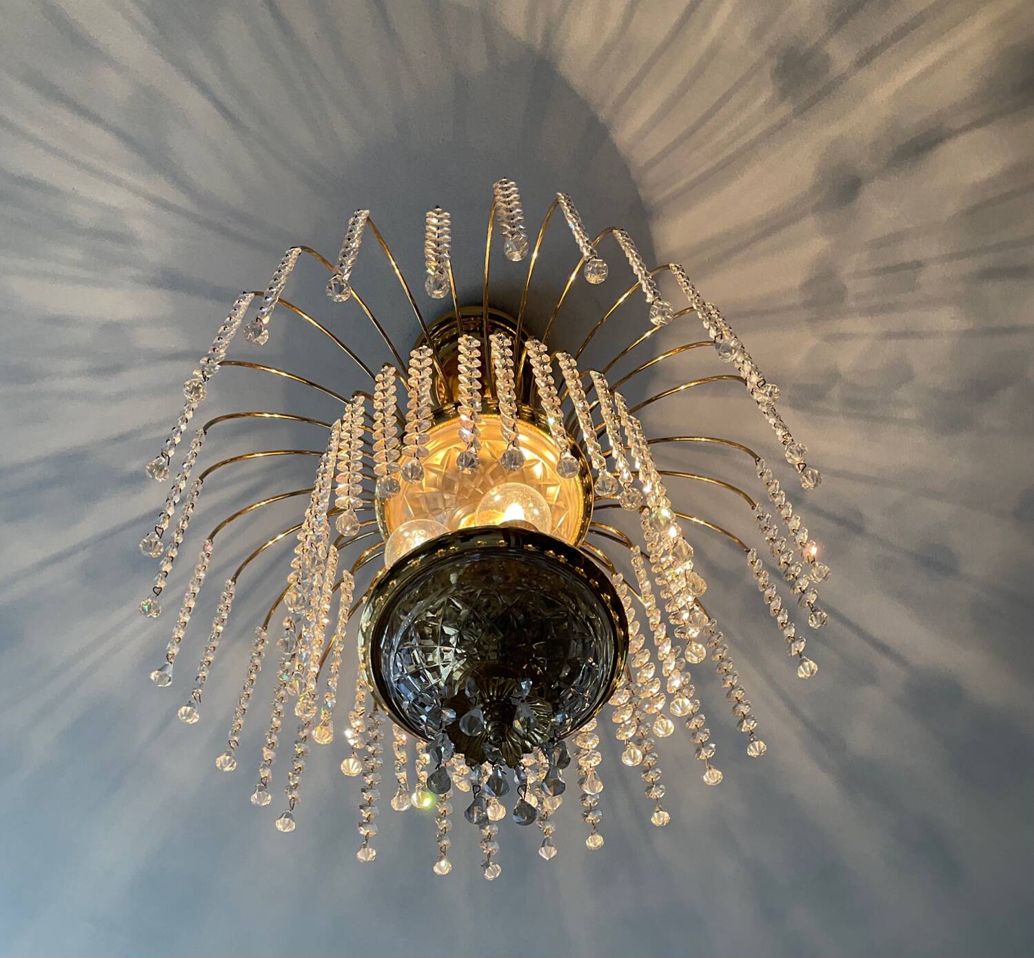 Brass waterfall chandelier with crystal tassels