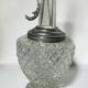 Vintage glass decanter with cut design and silver-plated metal, stopper included.