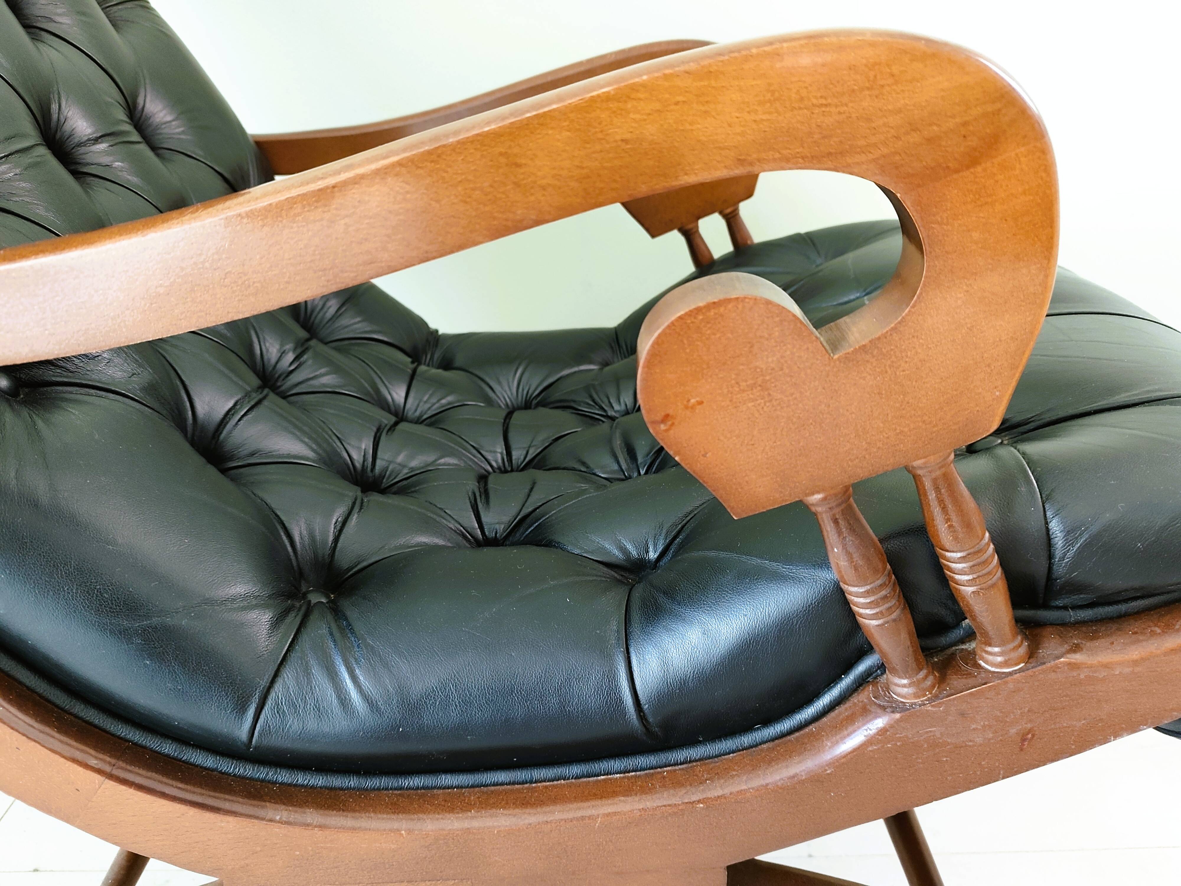 Black leather rocking Chesterfield armchair