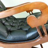Black leather rocking Chesterfield armchair