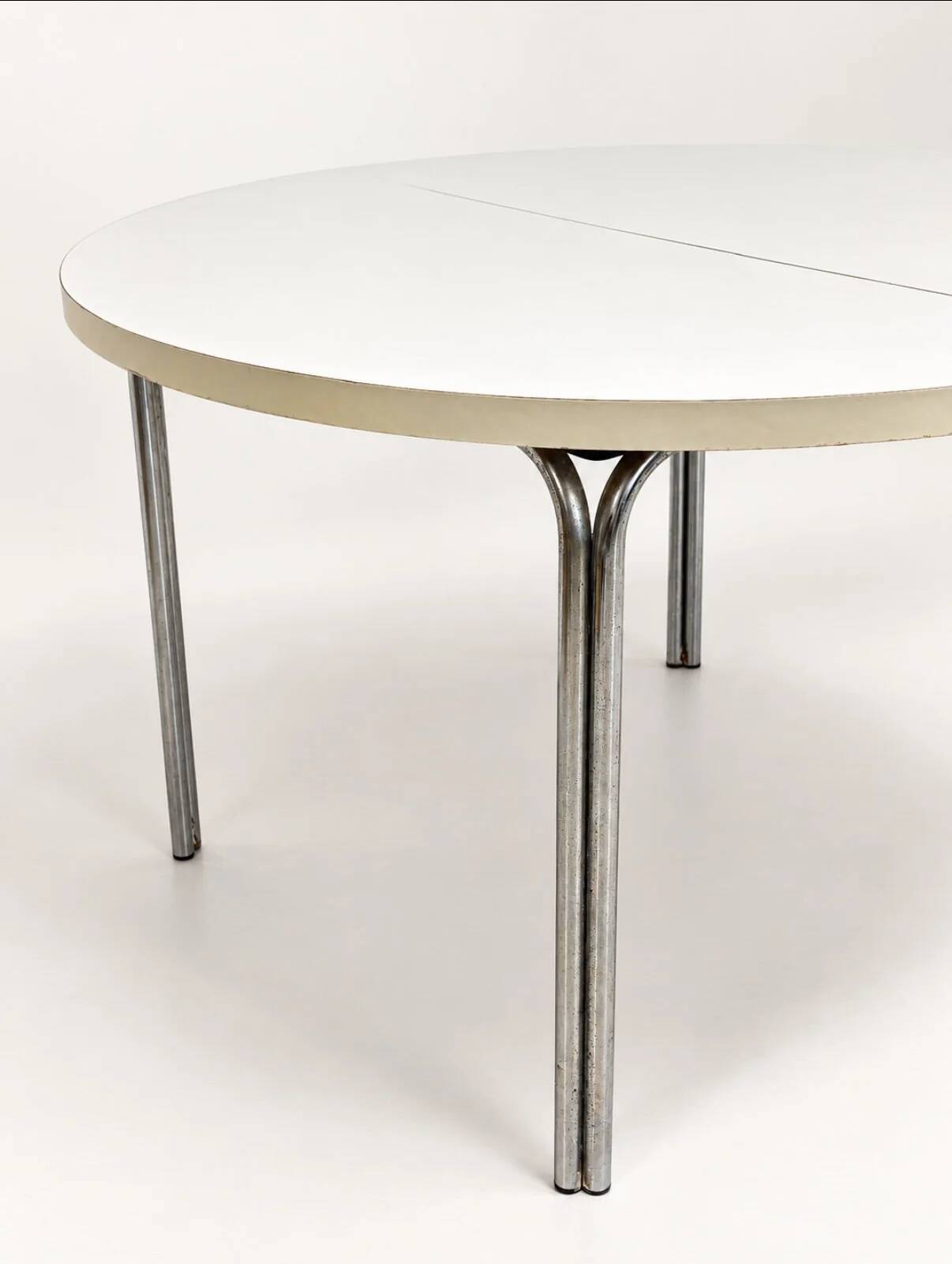 Vintage round extendable dining table, white laminate on chrome legs.
