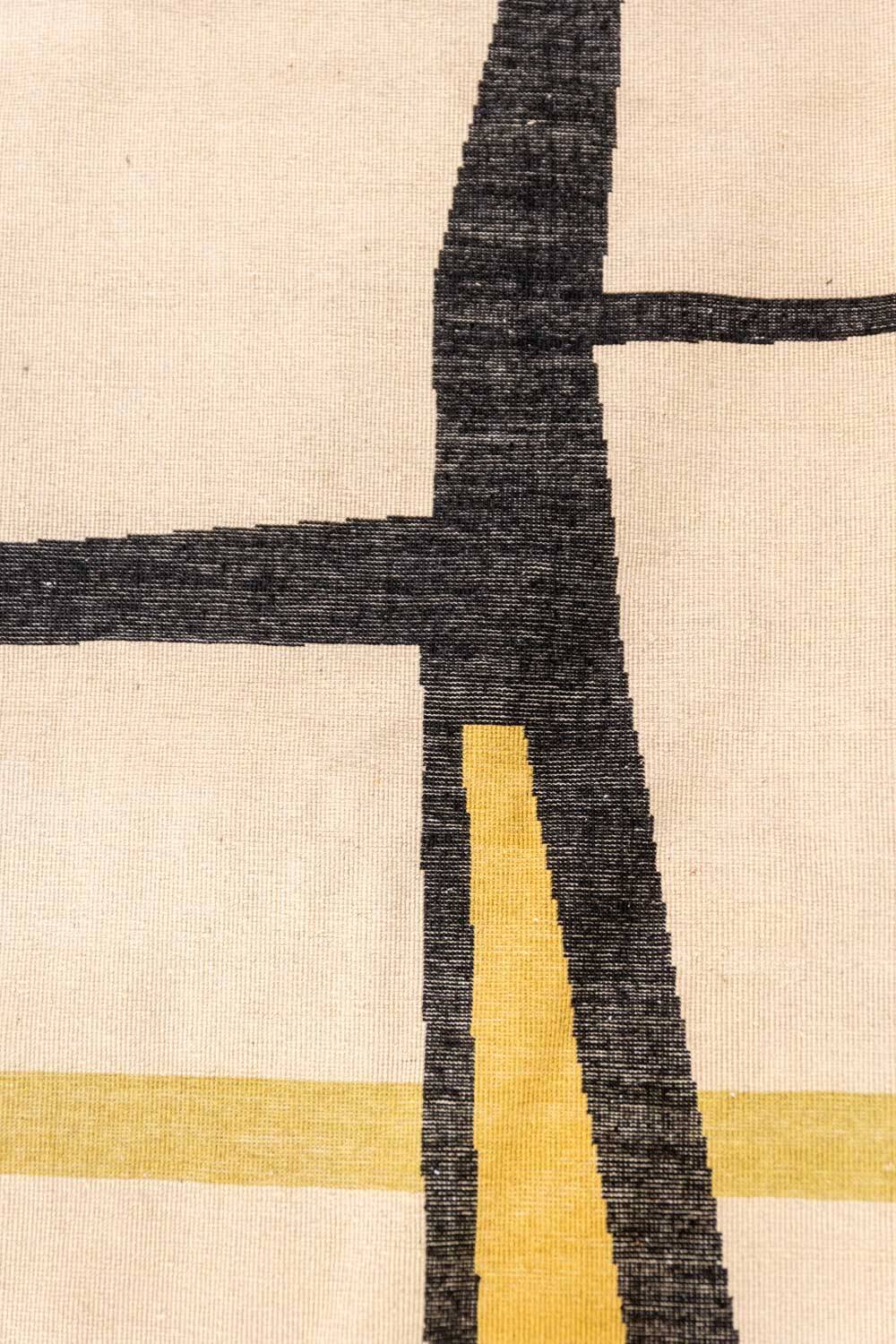 Handwoven wool tapestry with colourful geometric design. 2026.