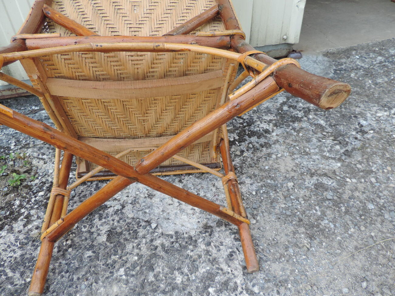 Rattan armchair with high backrest