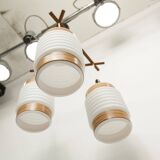 Scandinavian triangle pendant light in cascade with 3 opalines