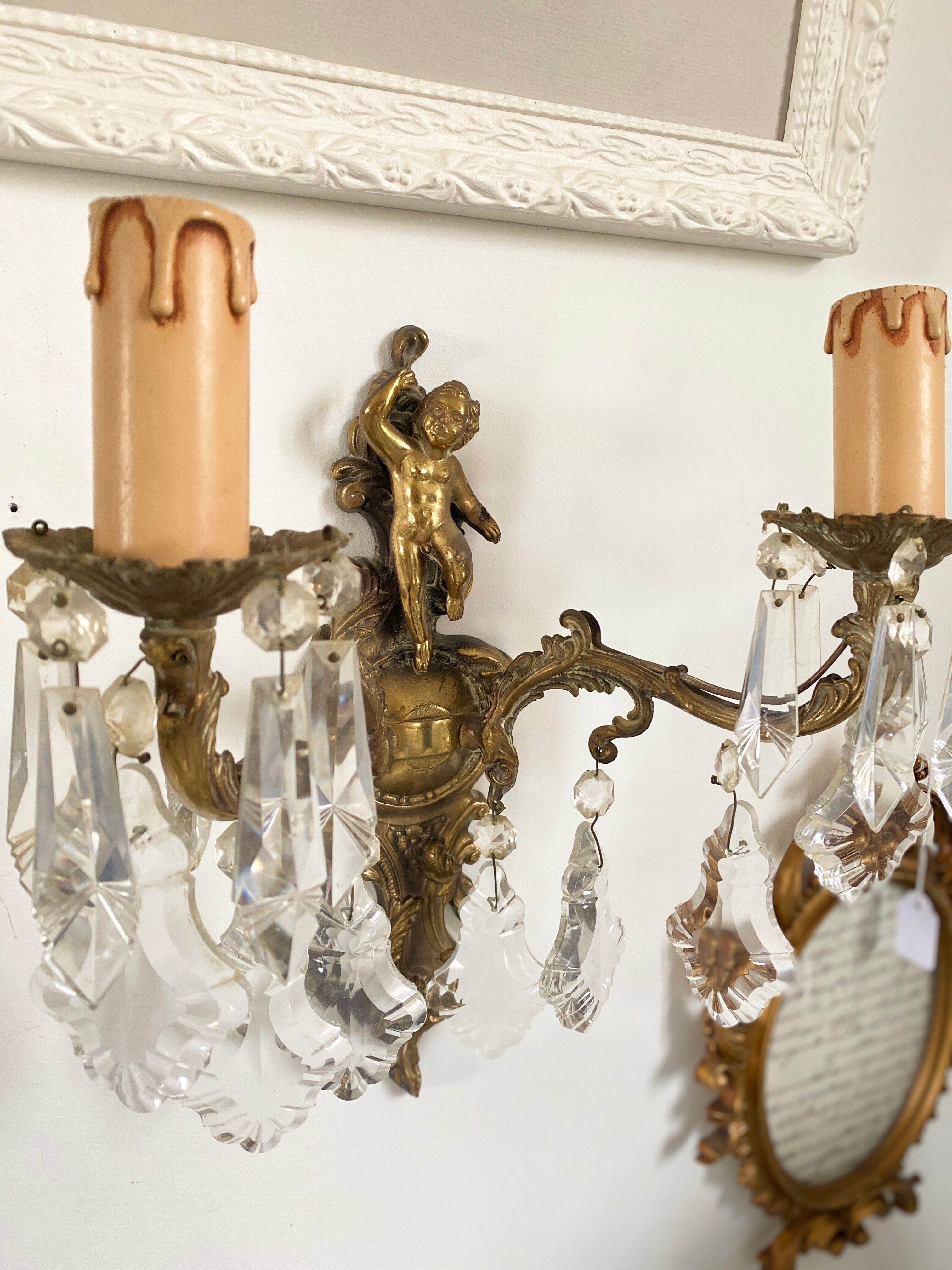 Two bronze spokes with tassels