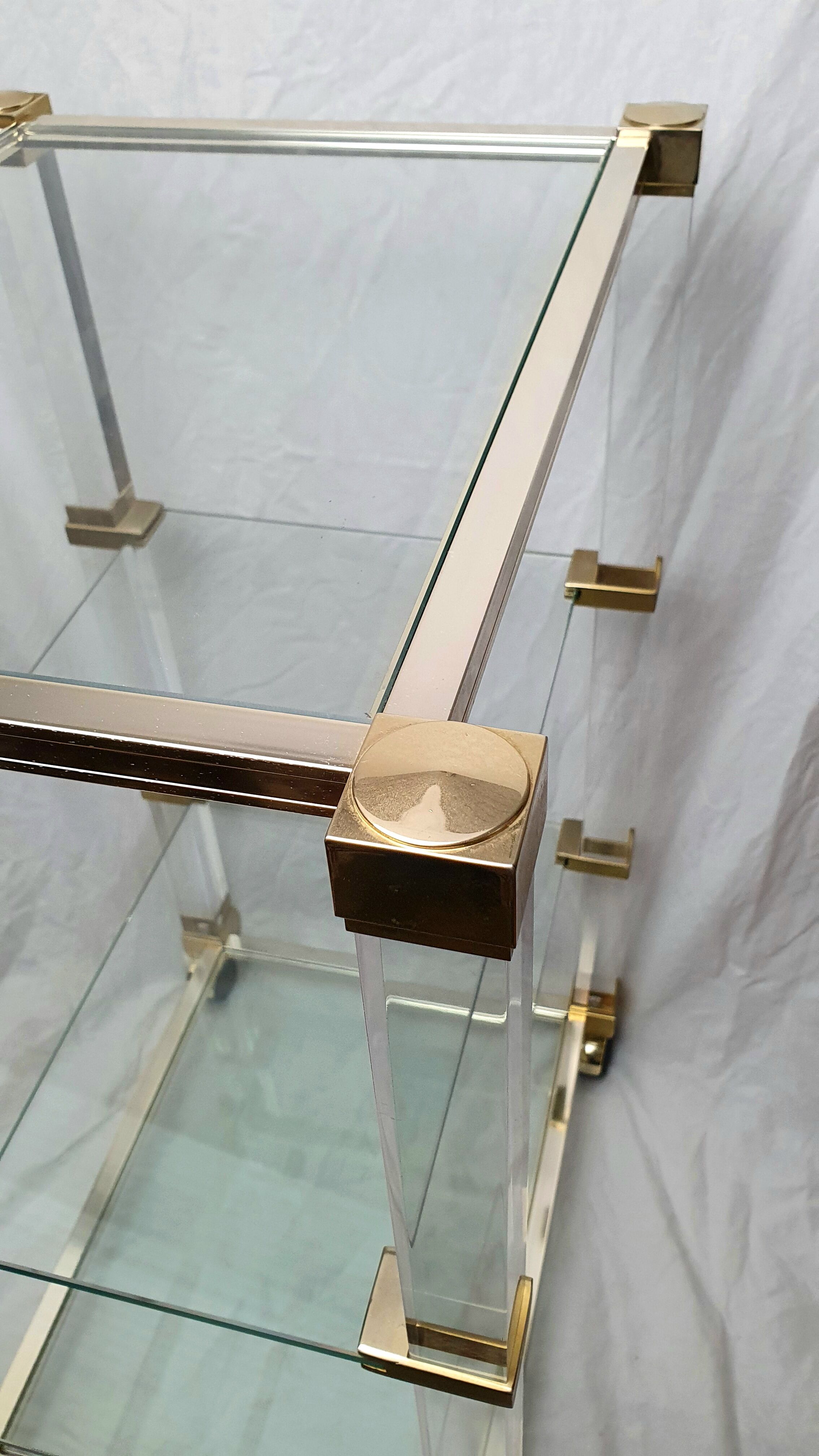 Rolling glass and plexiglass shelf by Pierre Vandel