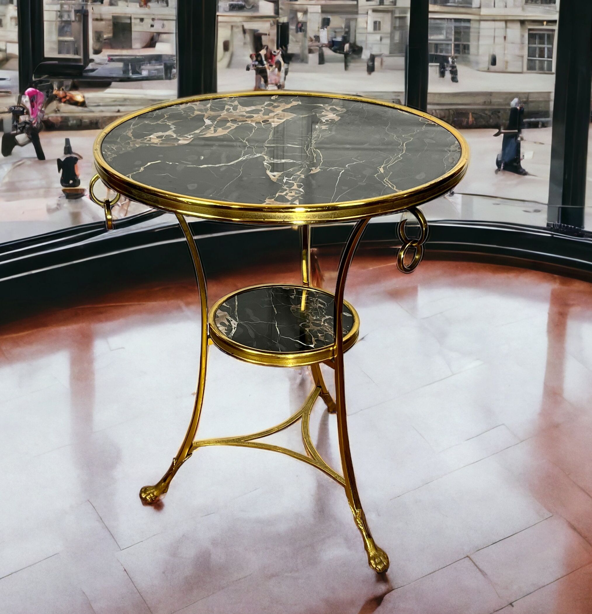 Gueridon tripod with gilded bronze frame covered with portor marble