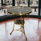 Gueridon tripod with gilded bronze frame covered with portor marble