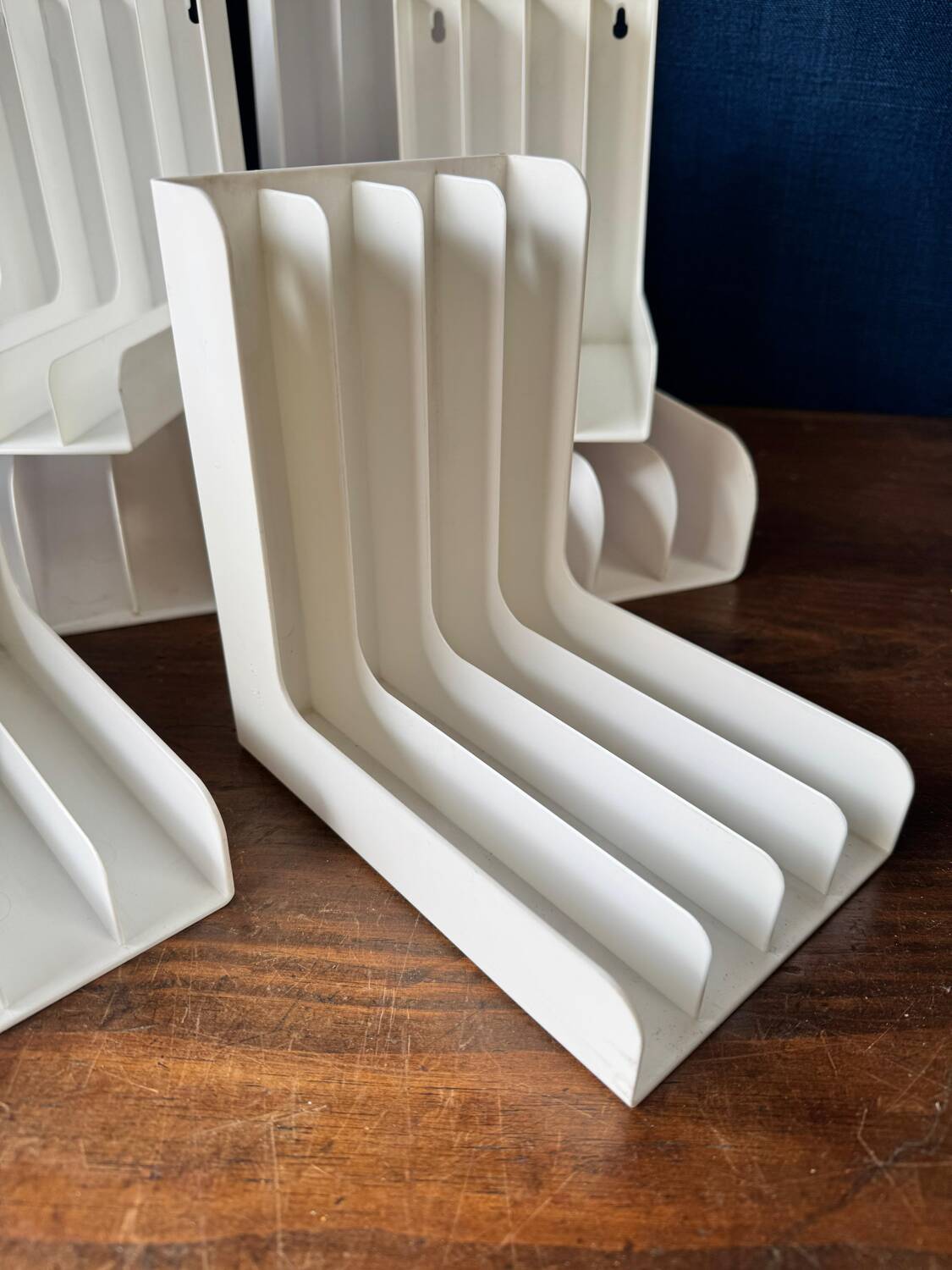 Set of 6 boomerang-shaped vinyl record racks/storage units. 1970s/80s.