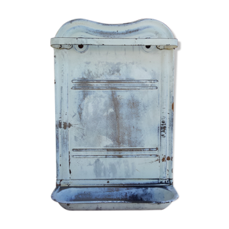 White ladle hangs with bowl