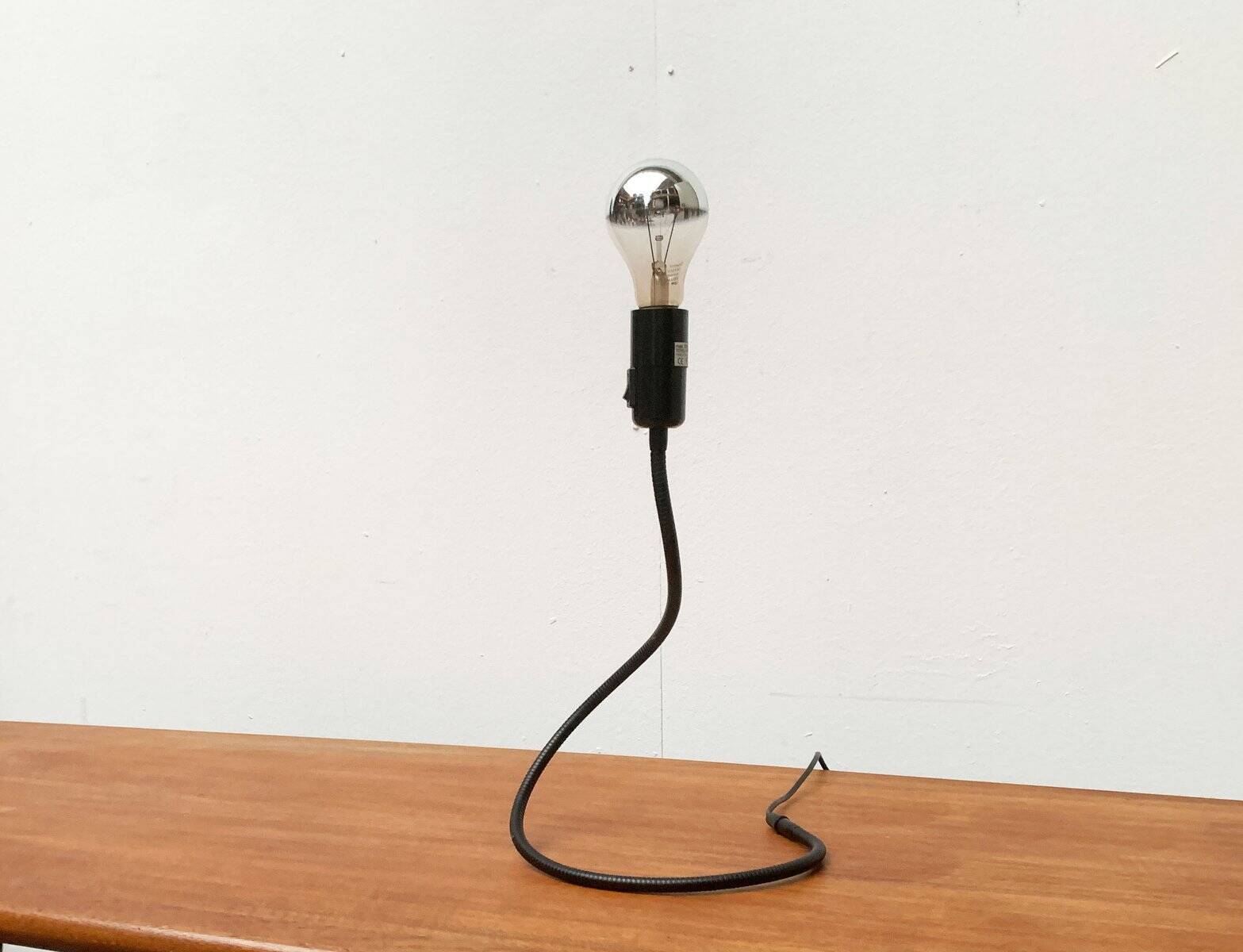 Lightworm minimalist table lamp by Walter Schnepel for Tecnolumen.