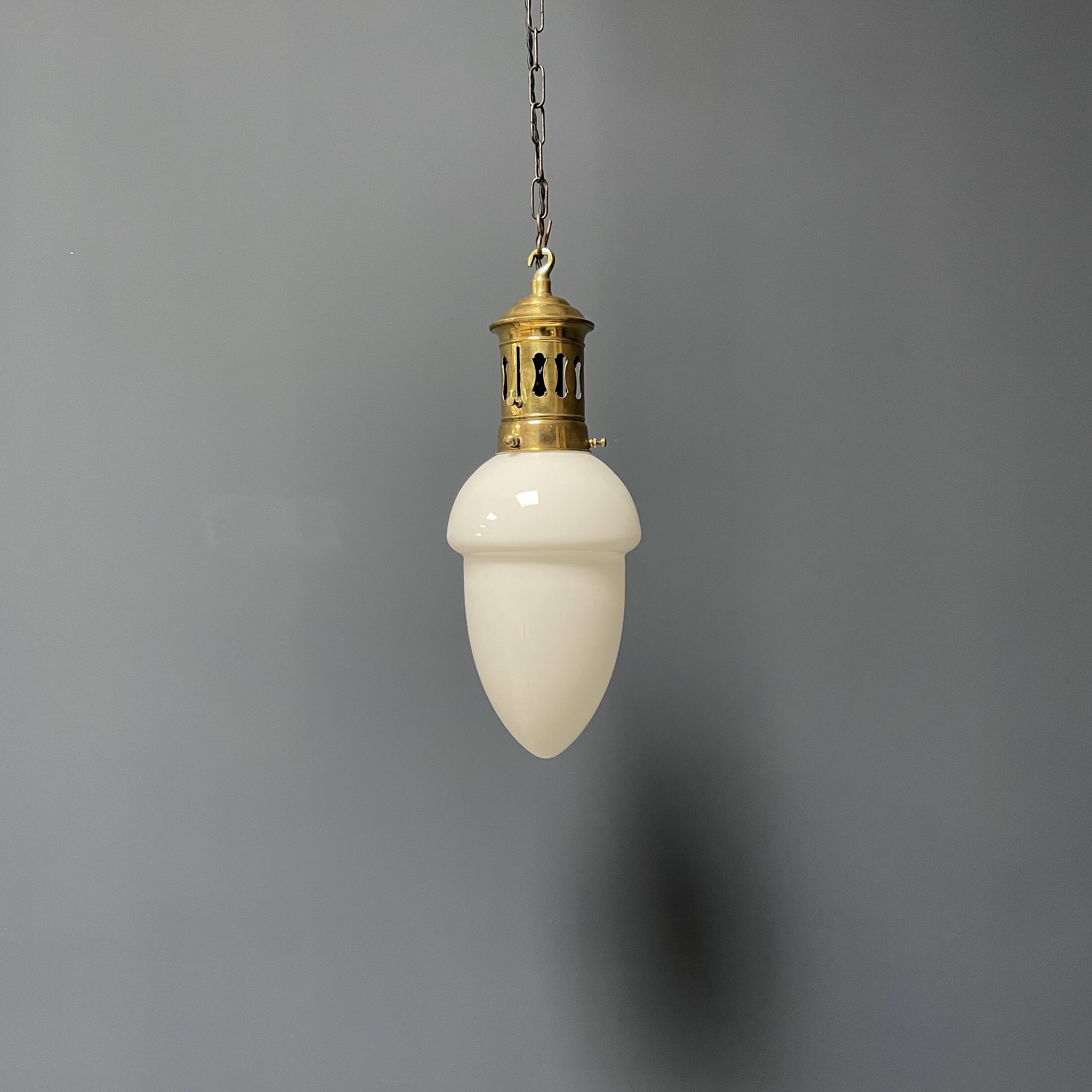 Opaline glass pendant lamp with elegant brass fixture