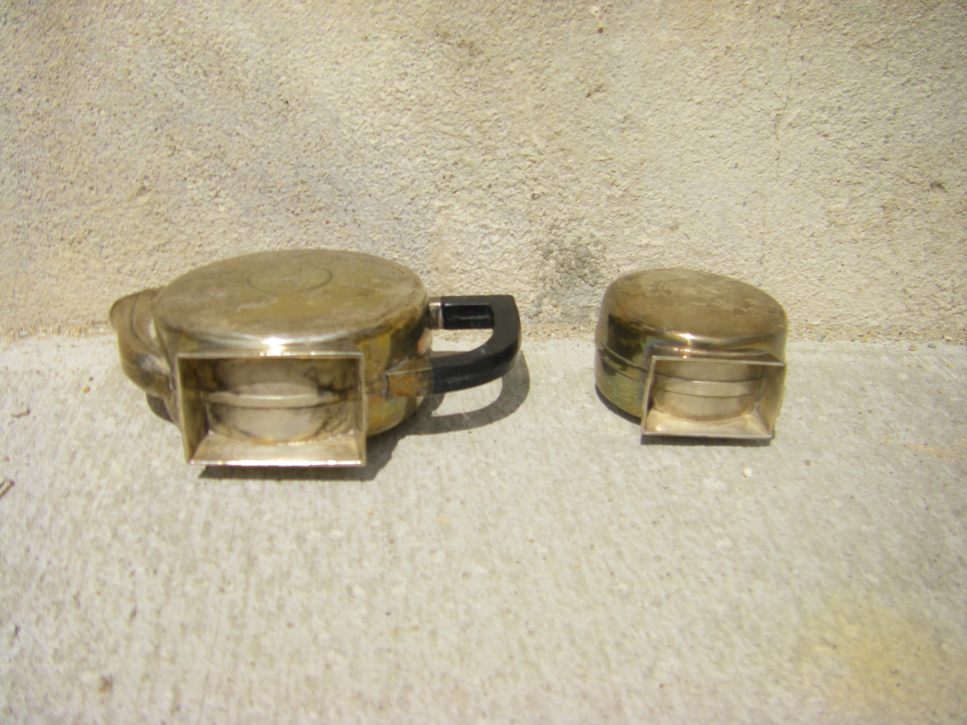 Set of a teapot and a silver metal sugar bowl