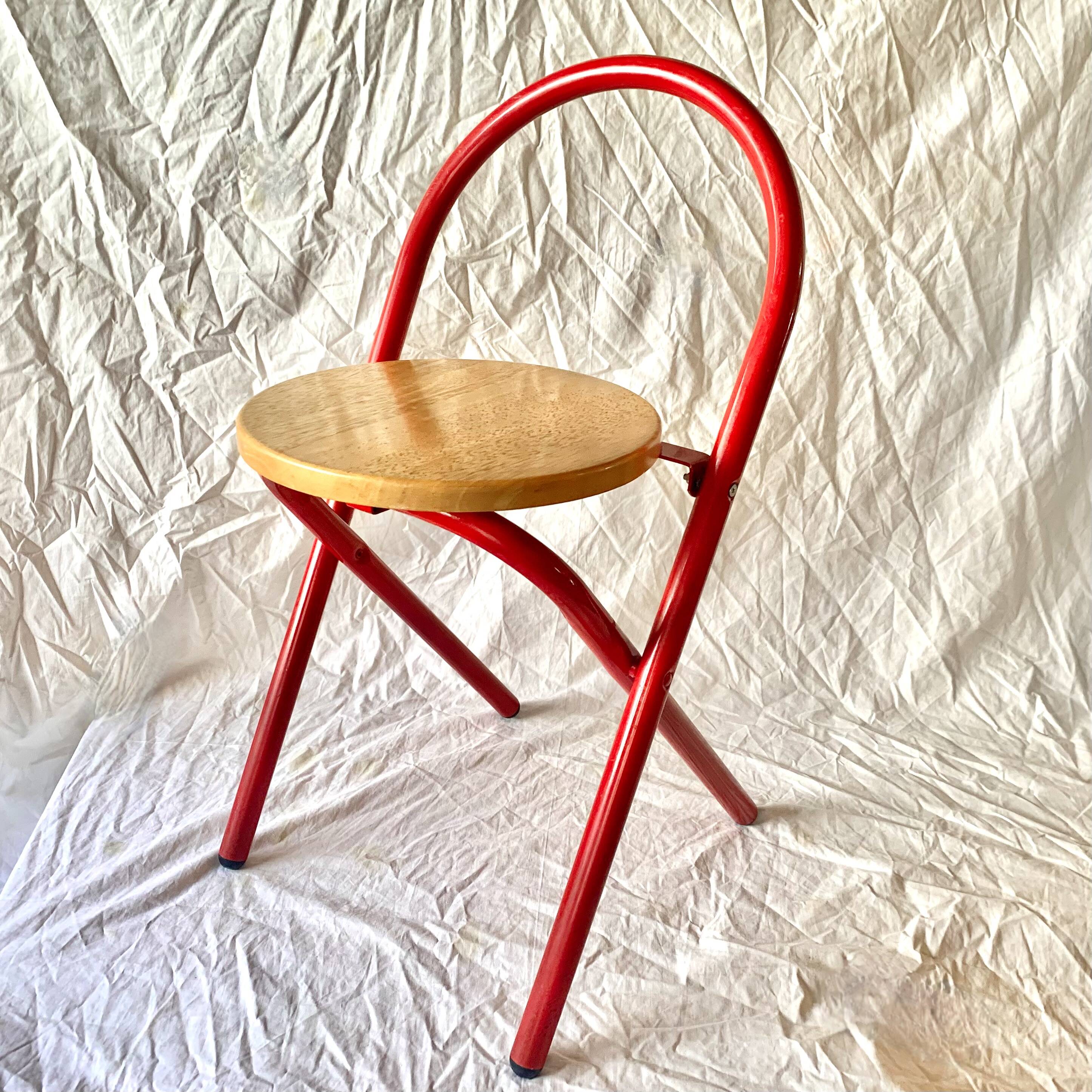 Vintage folding chair in red painted metal and wood