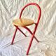 Vintage folding chair in red painted metal and wood