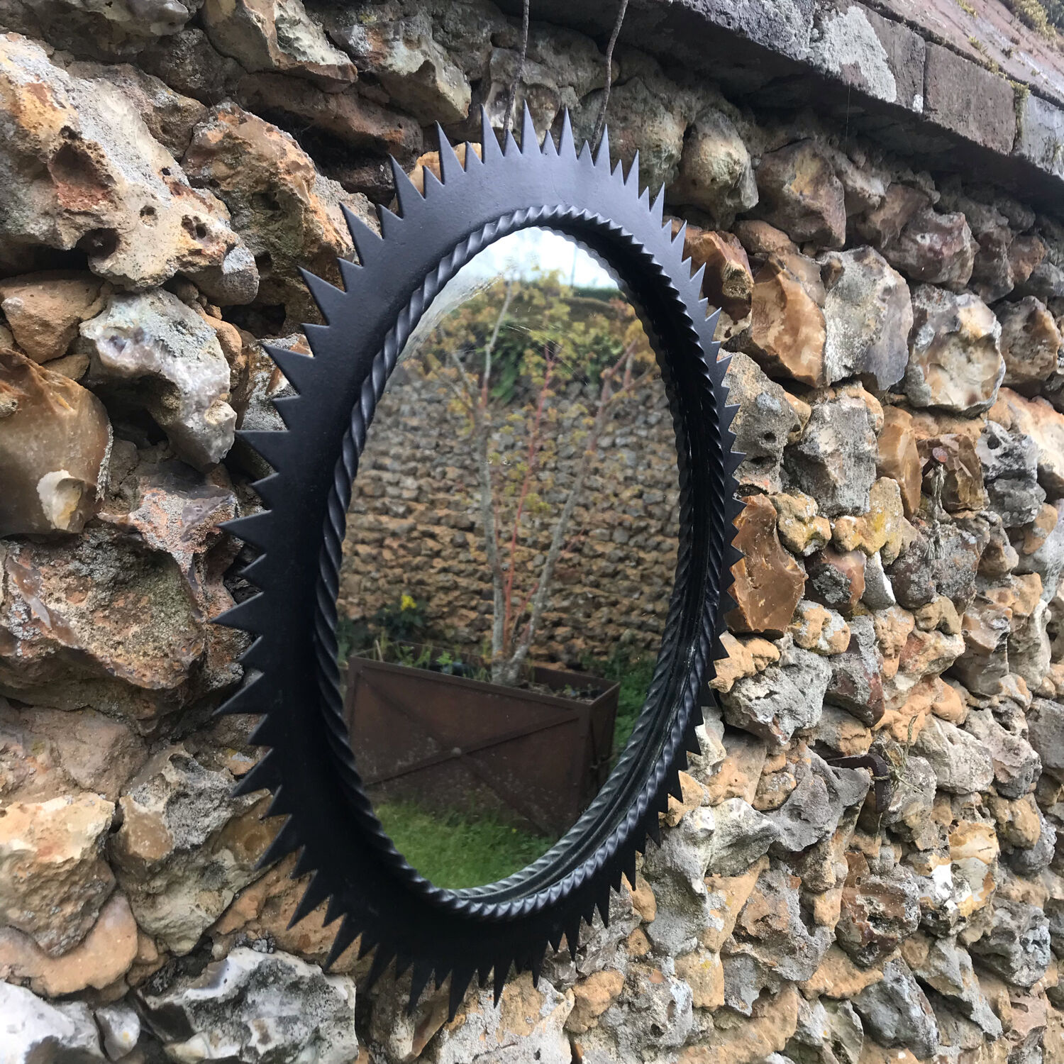 Vintage black metal sun mirror 1960