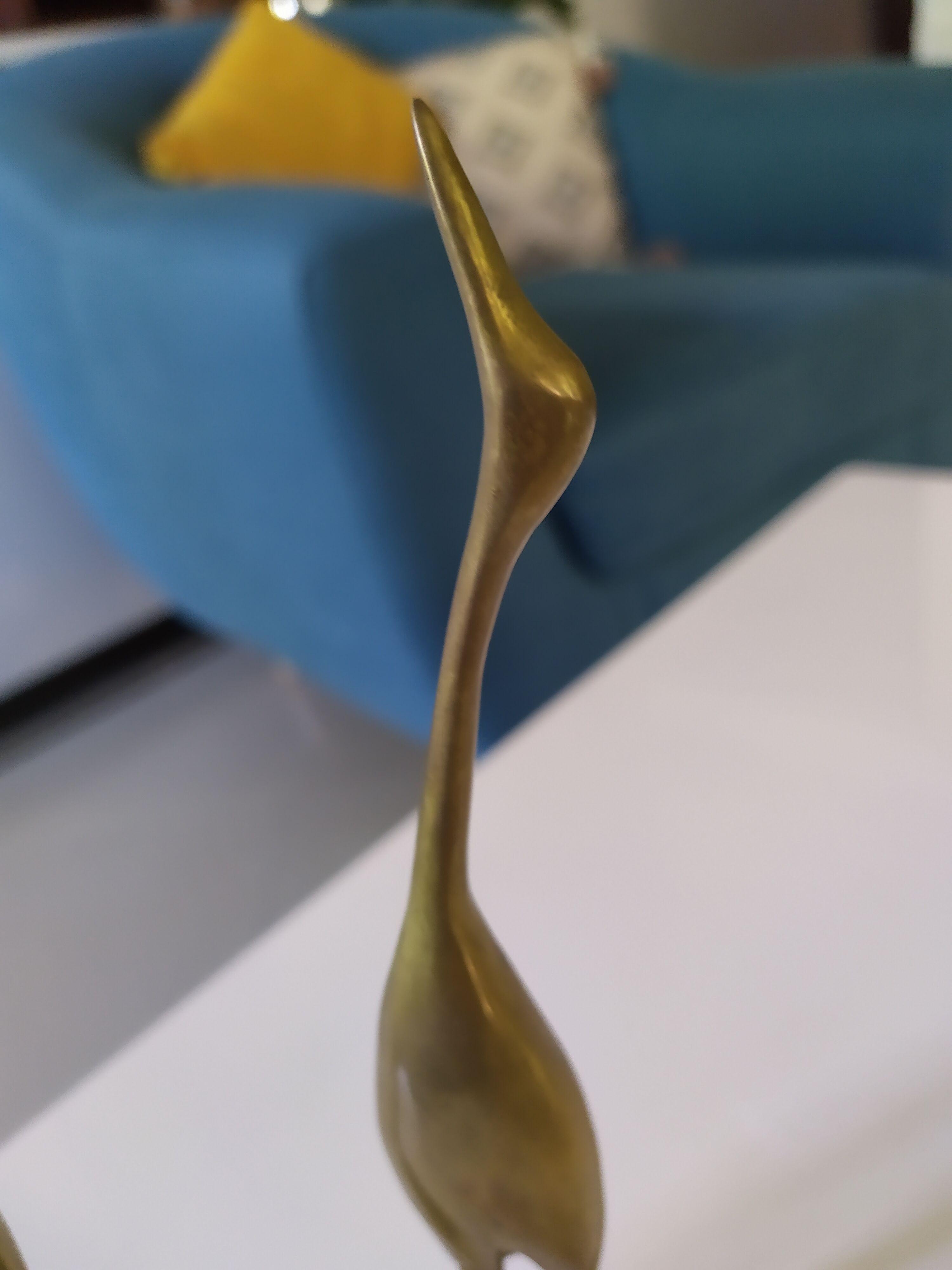 Coupled with brass herons