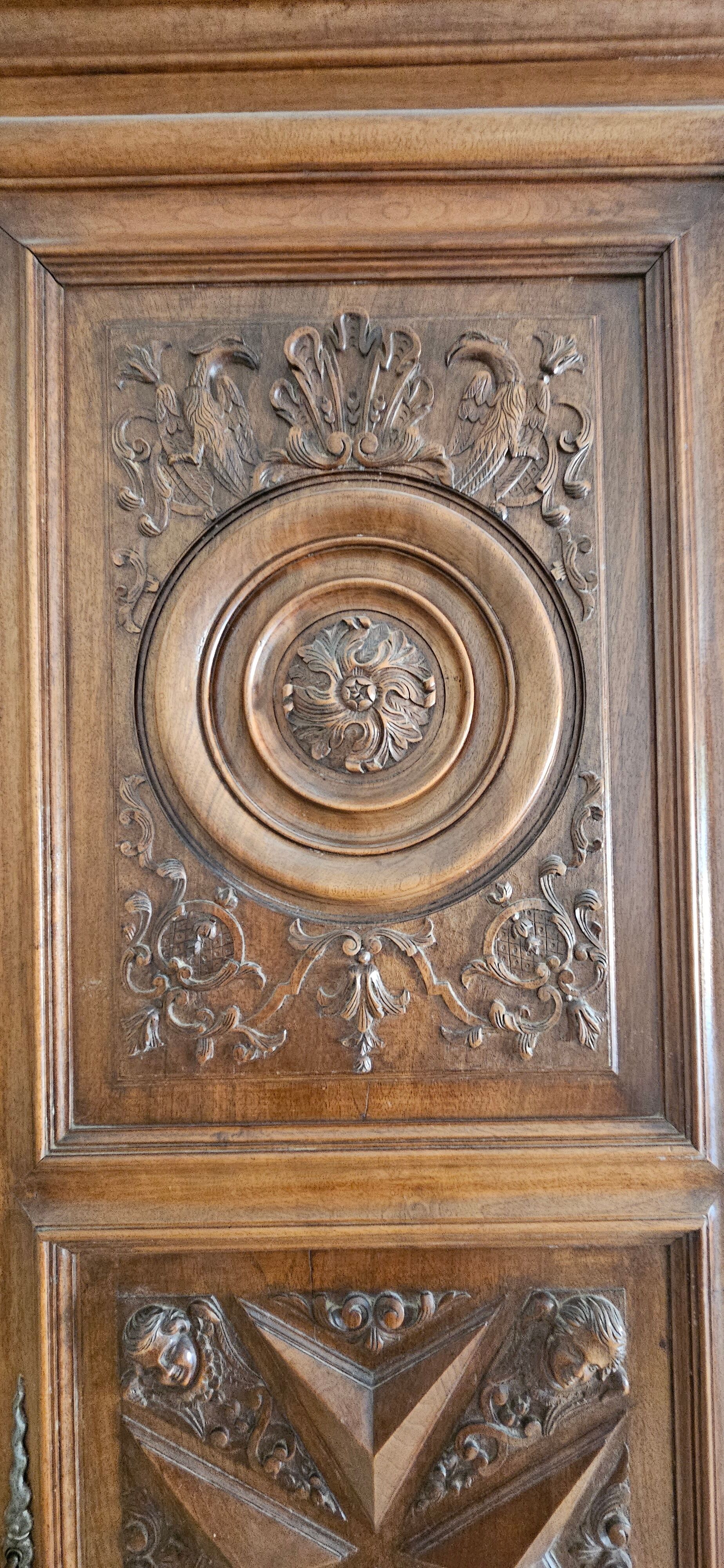 Carved cherubs cabinet