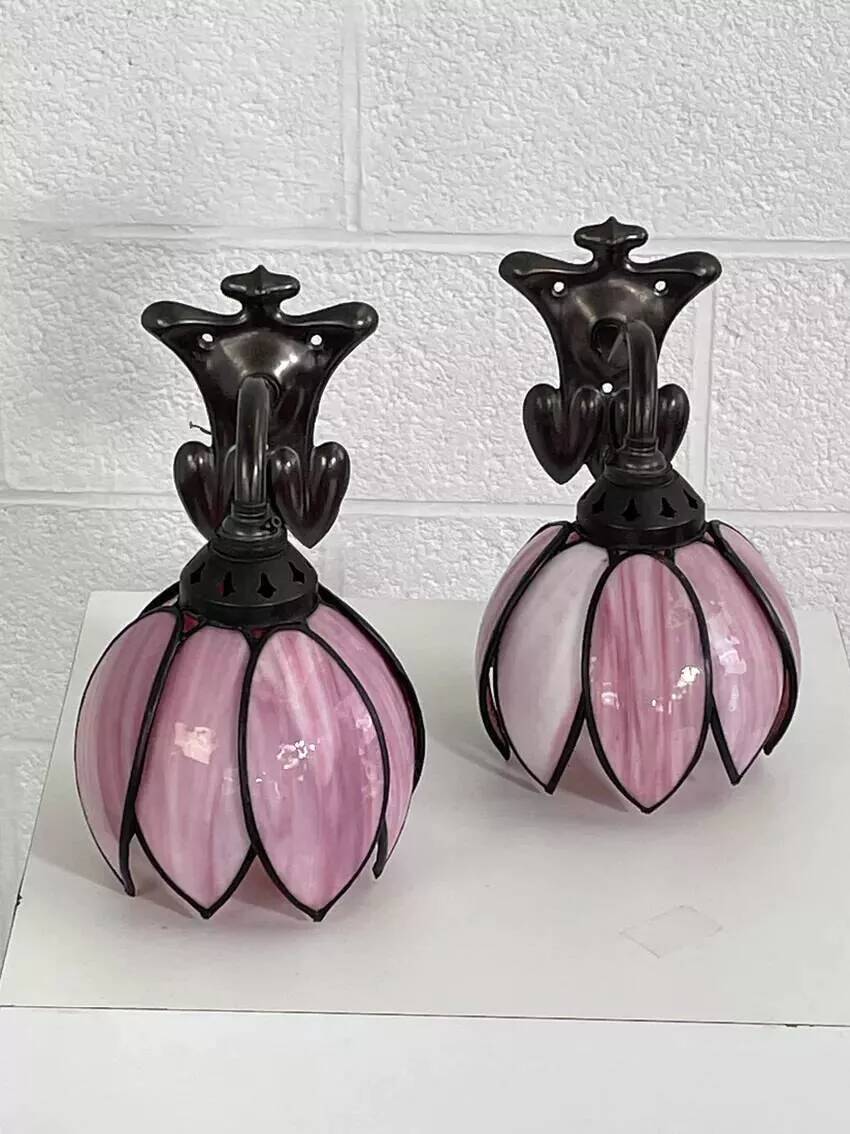 Pair of Tiffany style iron and glass leg wall lights