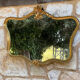 Miroir en bois doré sculpté et mouluré
