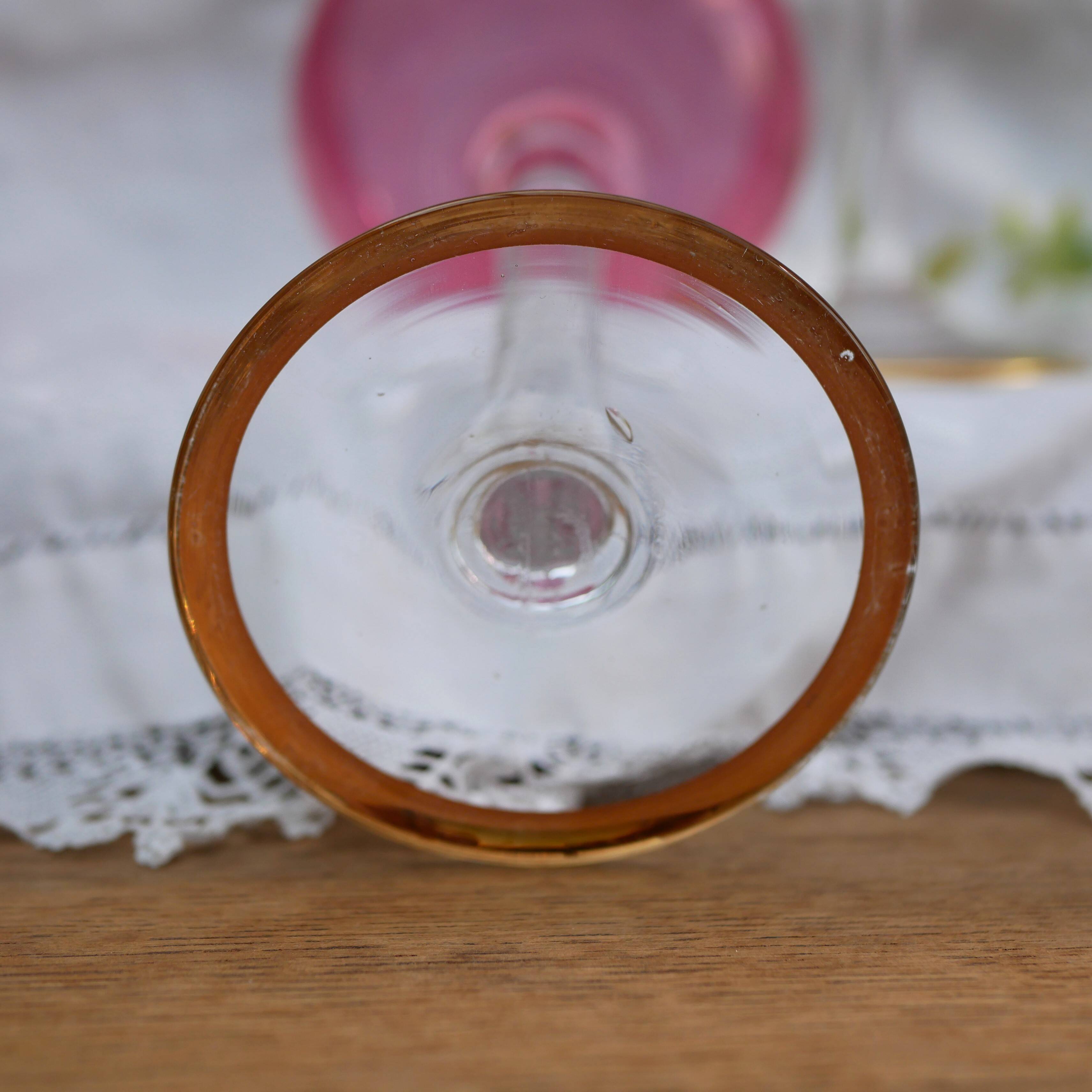 Four colorful stemmed wine glasses