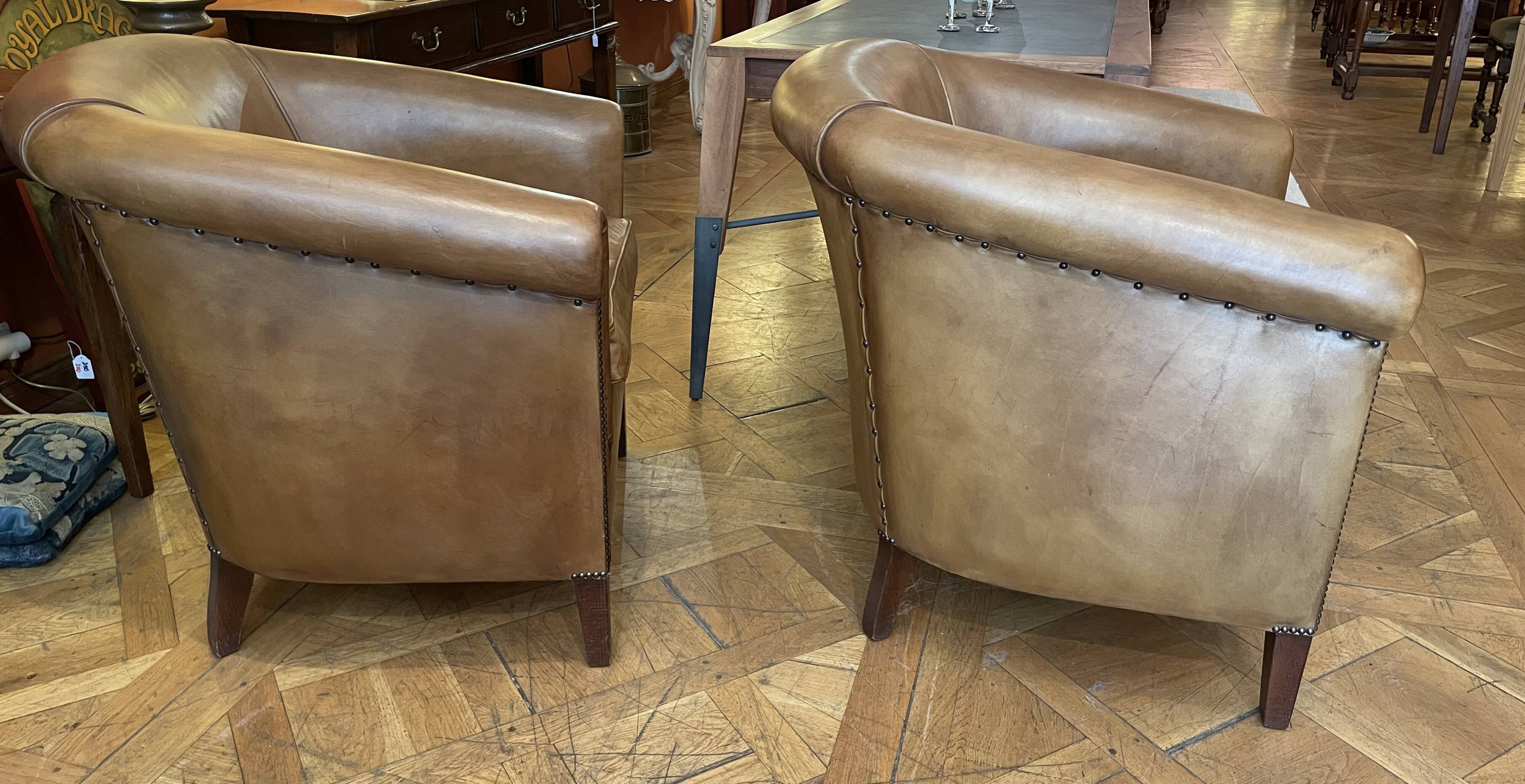 pair of camel leather club armchairs