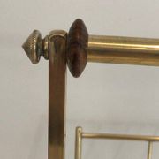 Brass and wood magazine rack, in the style of Cesare Lacca.