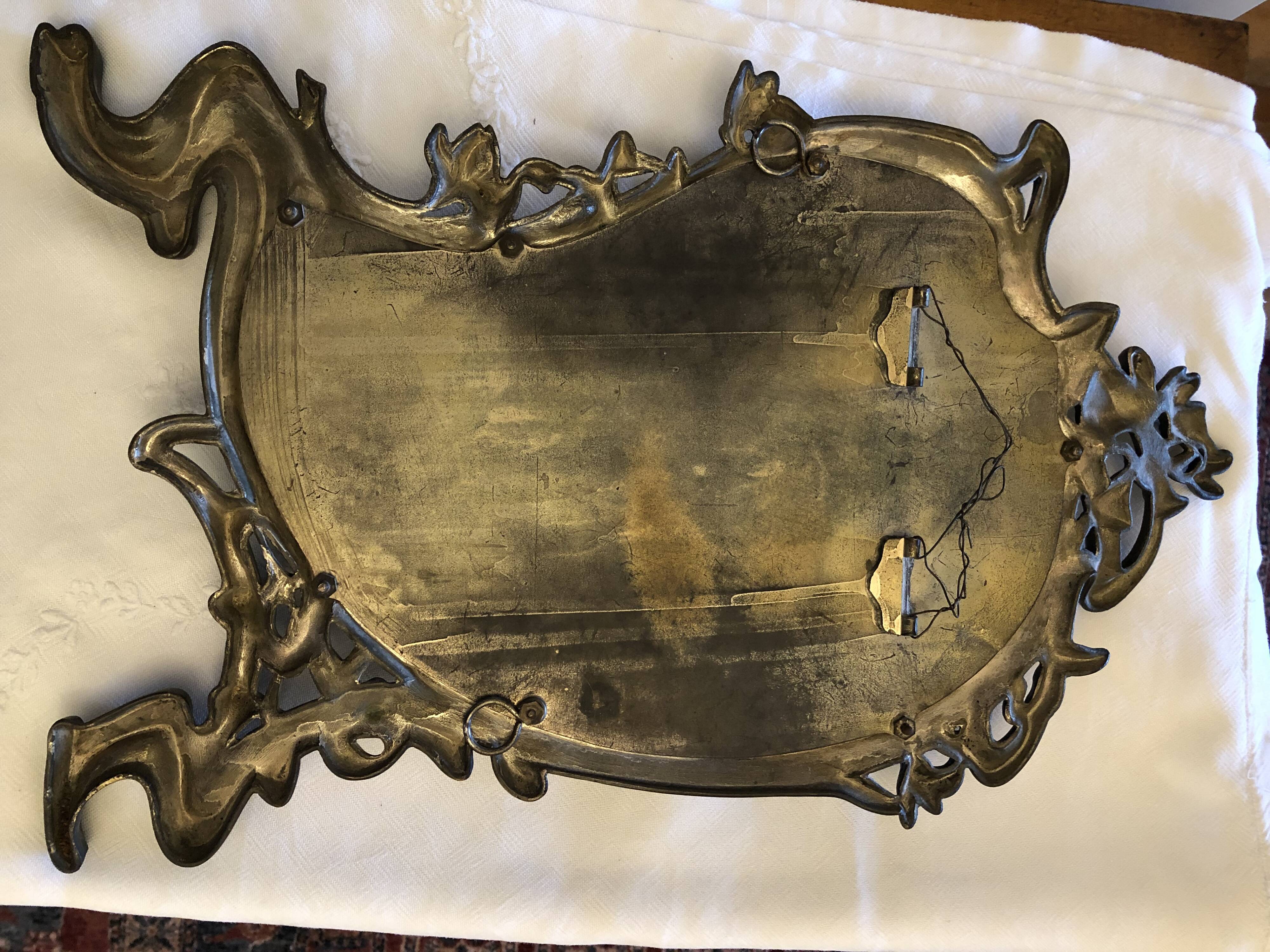 Mirror in gilded bronze and beveled glass 30x48cm