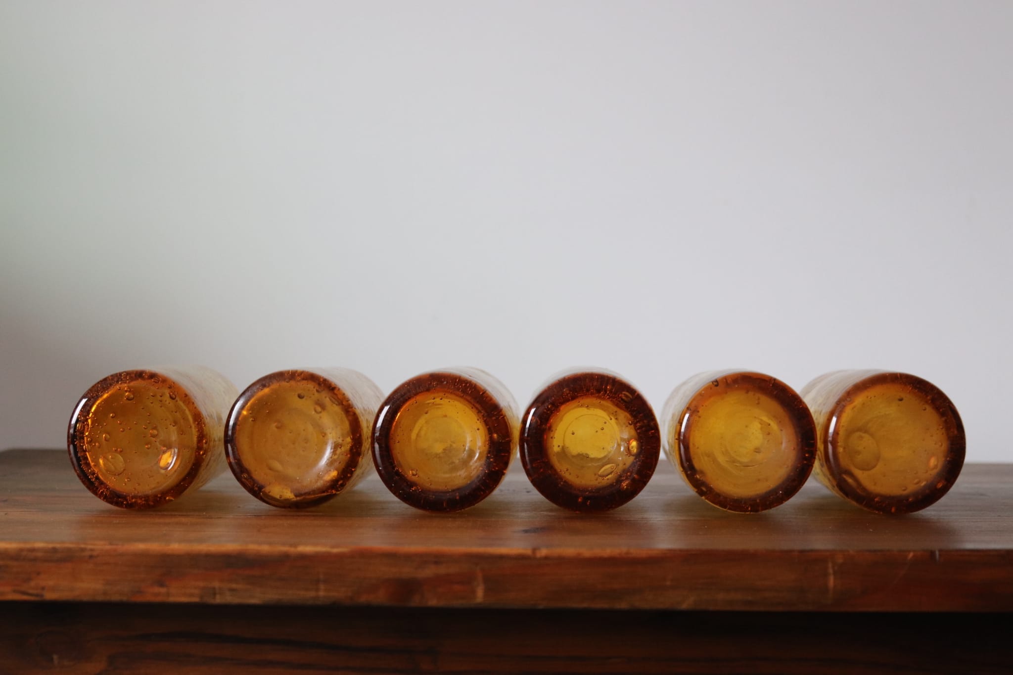 Set of 6 amber, blown and bubbled Biot glasses