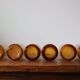 Set of 6 amber, blown and bubbled Biot glasses