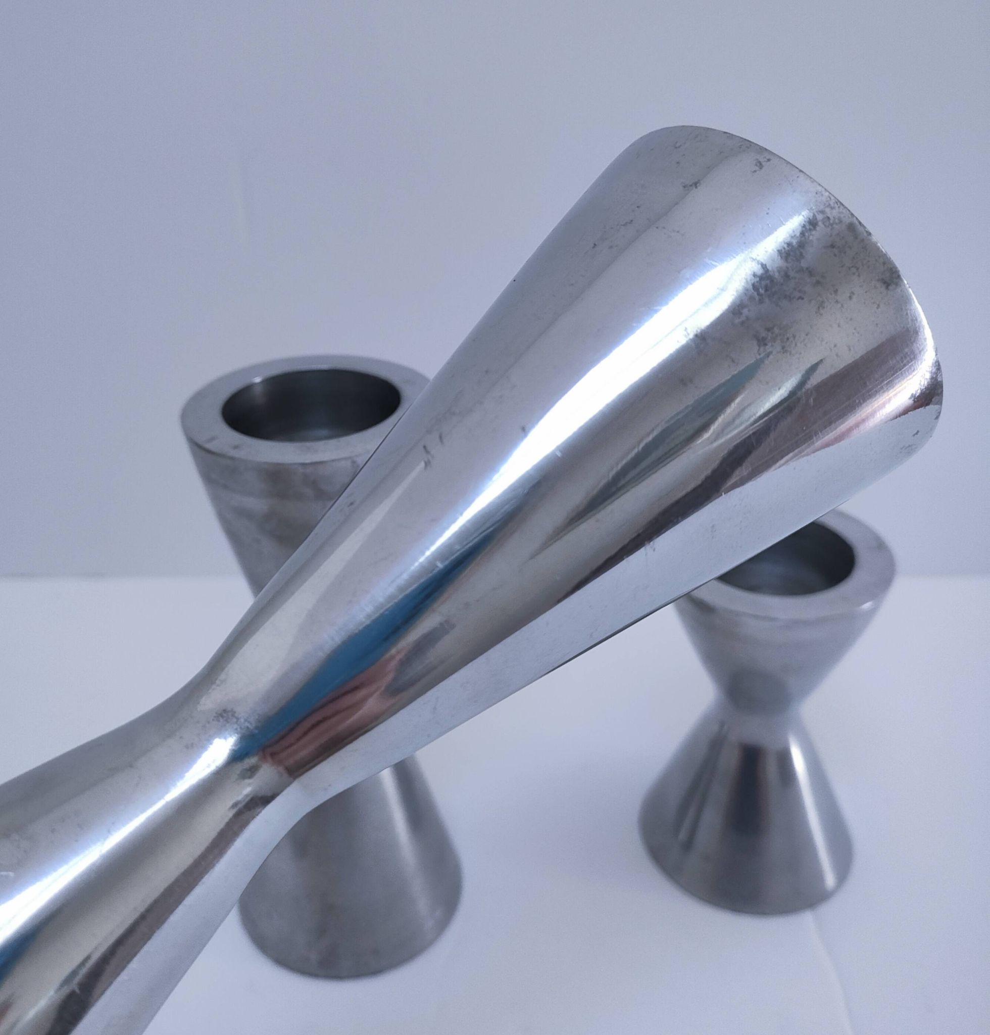 three "diabolo" aluminium design candle holders 90