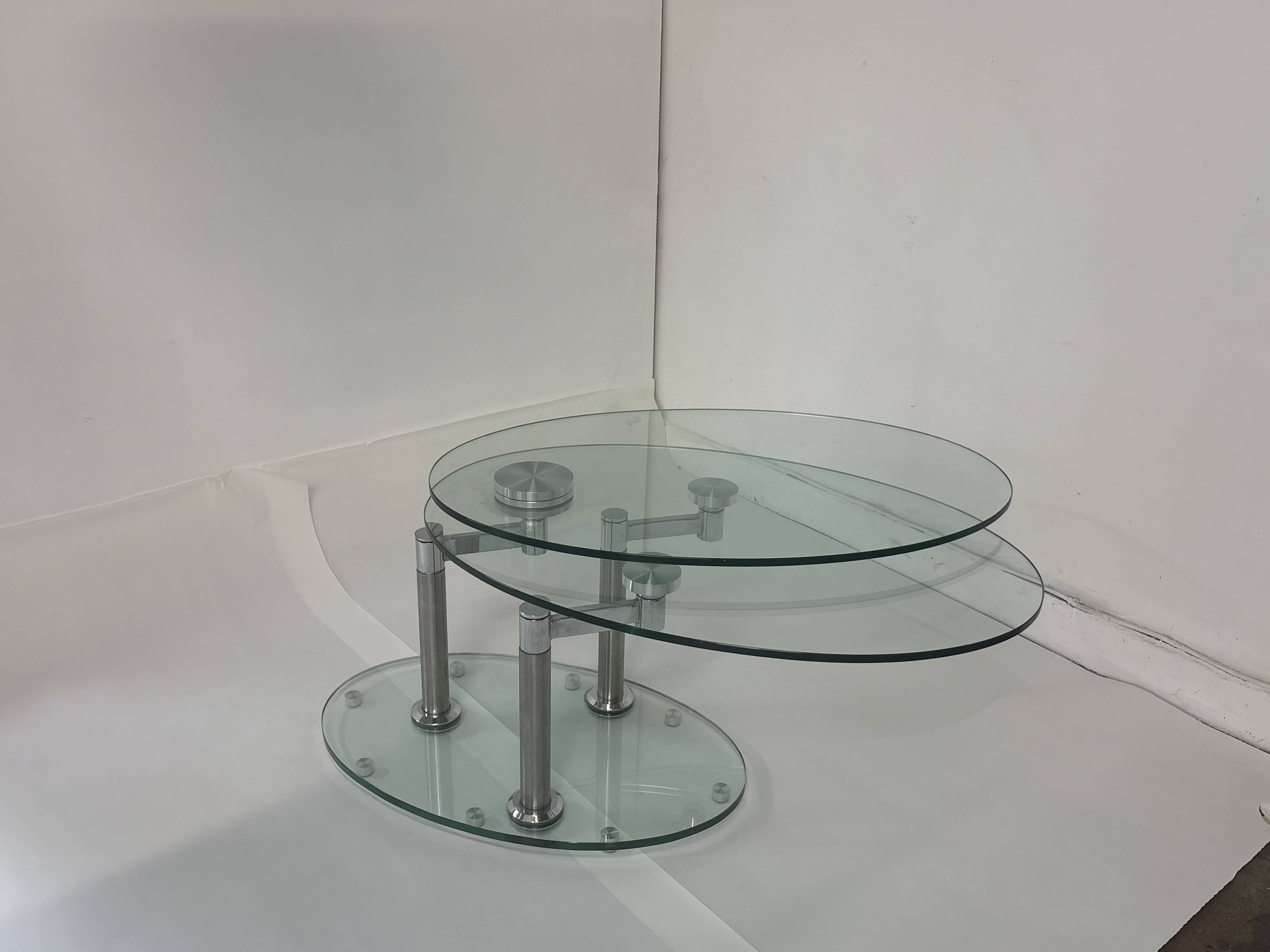 Oval designer coffee table in tempered glass