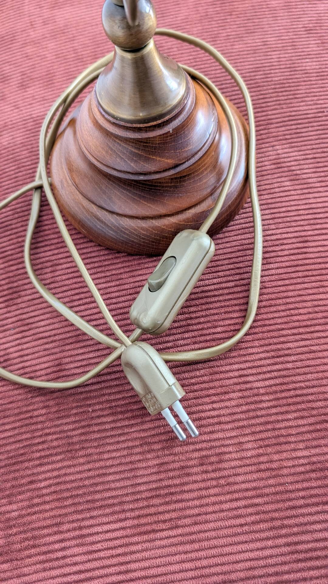 Vintage lamp made of turned wood, brass, and frosted glass.