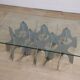 Minimalist sculptural coffee table in metal and glass