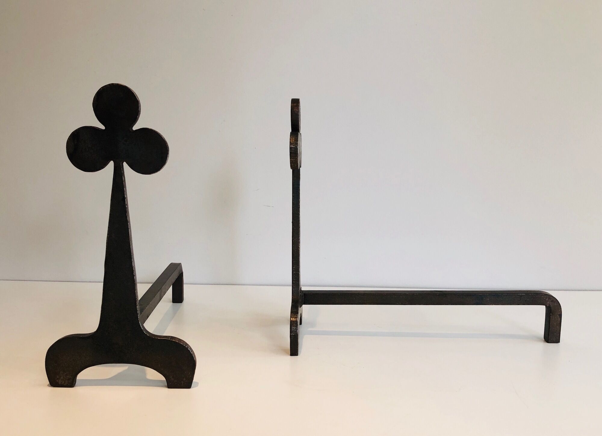 Pair of wrought steel and iron chenets with clover decorations 1950