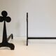 Pair of wrought steel and iron chenets with clover decorations 1950